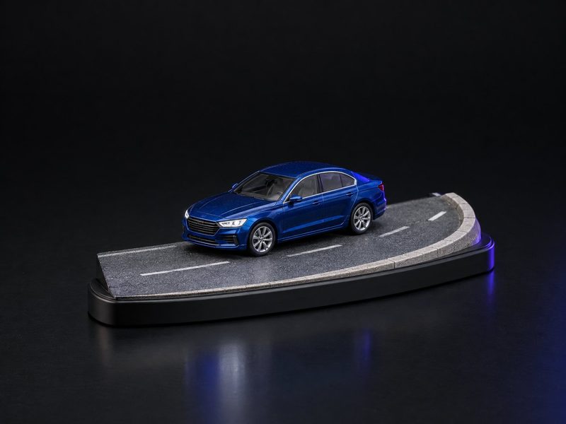 Concept render: Delivery road. The car at 1:43 on a ribbon of road, the owner's name on the kerb.